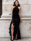 FJØRNA black velvet halter evening gown with a high slit and knotted design, elegant maxi dress for formal occasions.