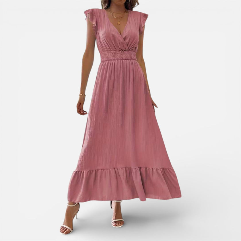 FJØRNA women's sleeveless maxi dress with flowy fit and timeless style, shown in a natural fabric and elegant design.
