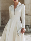 FJØRNA zip-front long sleeve fit-and-flare midi dress for women, shown in a stylish design with a fitted bodice and flared skirt.
