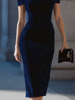 Navy velvet off-shoulder bodycon midi dress by FJØRNA, fitted design with elegant off-shoulder neckline and midi length.