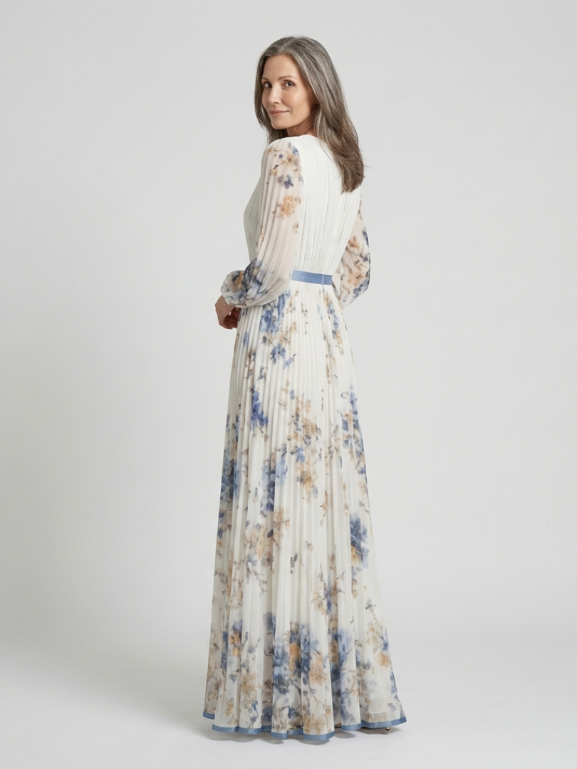 FJØRNA women’s floral summer maxi dress with long sleeves, flowing fabric, and vibrant flower pattern perfect for warm weather.