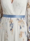 Floral long sleeve summer maxi dress for women by FJØRNA, flowing fabric with vibrant floral pattern and elegant design.