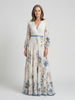 FJØRNA women's floral summer maxi dress with long sleeves, flowing fabric and vibrant botanical print.