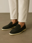 Men's dark green suede FJØRNA moccasin slippers with a soft, textured sole and classic slip-on design.