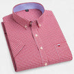 FJØRNA men's short sleeve Oxford cotton button-up shirt in light blue, showing collar and front button details.