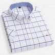 Men's FJØRNA Oxford cotton short sleeve button-up shirt with a classic collar and button front, displayed on a hanger.