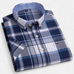 Men's FJØRNA Oxford cotton short sleeve button-up shirt displayed on a hanger with a classic collar and clean design.