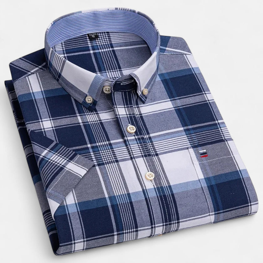 Men's FJØRNA Oxford cotton short sleeve button-up shirt displayed on a hanger with a classic collar and clean design.
