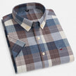 Men's FJØRNA Oxford cotton short sleeve button-up shirt displayed on a hanger, featuring a classic collar and button front.