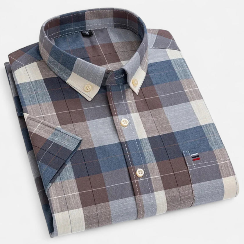 Men's FJØRNA Oxford cotton short sleeve button-up shirt displayed on a hanger, featuring a classic collar and button front.