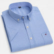 Men's FJØRNA Oxford cotton short sleeve button-up shirt displayed on a hanger, featuring a classic collar and button front design.