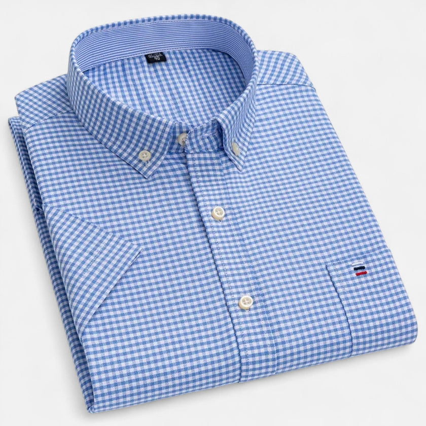 Men's FJØRNA Oxford cotton short sleeve button-up shirt displayed on a hanger, featuring a classic collar and button front design.