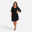 Women's chiffon layered midi dress by FJØRNA, knee-length and elegant, featuring a flowing, comfortable design.
