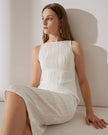 Red FJØRNA midi dress for women with pearl straps and textured water ripple fabric, stylish and elegant for special occasions.