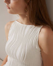 Red FJØRNA women's midi dress with pearl straps and water ripple textured fabric, featuring a fitted cami style.