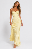 Women's floral jacquard corset maxi dress by FJØRNA, featuring intricate floral patterns and a fitted bodice, flowing length.