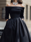 Elegant off-shoulder satin midi dress by FJØRNA featuring a fitted silhouette and flowing fabric, perfect for formal occasions.