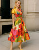 Red satin midi dress for women with A-line silhouette, pleated skirt, and puff sleeves by FJØRNA.