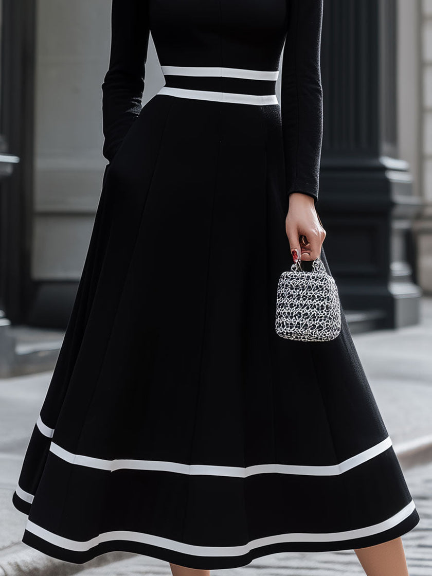 FJØRNA black and white contrast square neck midi dress with a vintage-inspired design and elegant midi length.
