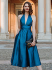 FJØRNA halter V-neck pleated midi dress for women, featuring a stylish design and flowing fabric, perfect for elegant occasions.