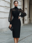 FJØRNA high-neck sheer sleeve tailored midi dress displayed flat with fitted silhouette and elegant design details.