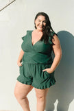 FJØRNA women's summer tankini set with ruffles and V-neck, featuring a stylish two-piece swimsuit in vibrant colors.