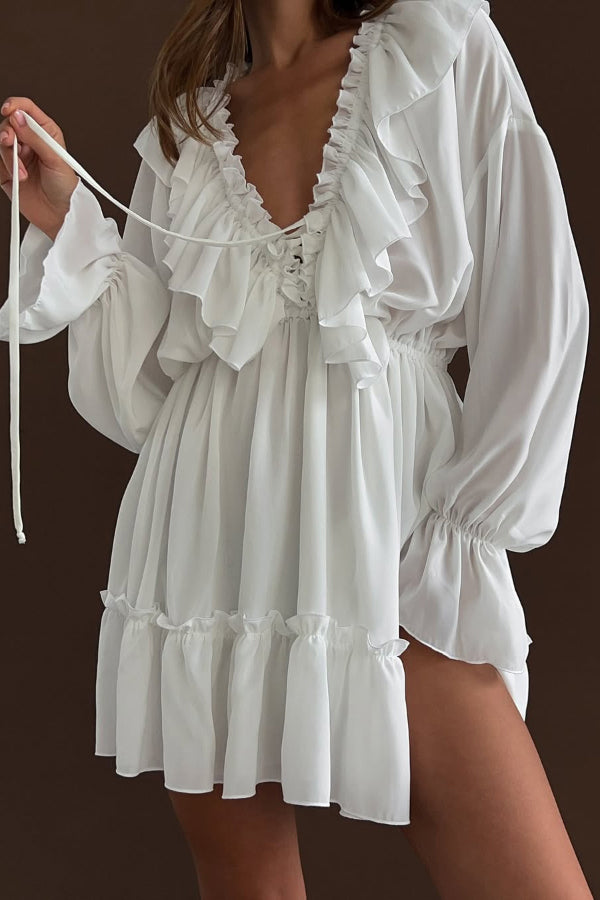 FJØRNA solid color V-neck ruffled long-sleeved mini dress with ruched detailing, ideal for casual or wedding occasions.