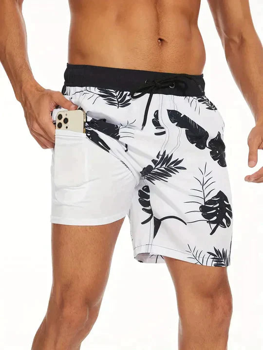 Men's FJØRNA secure fit swim shorts in navy with elastic waistband and side pockets, suitable for beach and swimming activities.