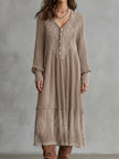 FJØRNA Whispered Snow Knit Maxi Dress displayed on a hanger, showcasing its soft knit fabric and elegant long length.