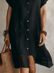 FJØRNA modern boho black linen midi dress with relaxed fit, effortless style, and flowy design for casual and stylish wear.