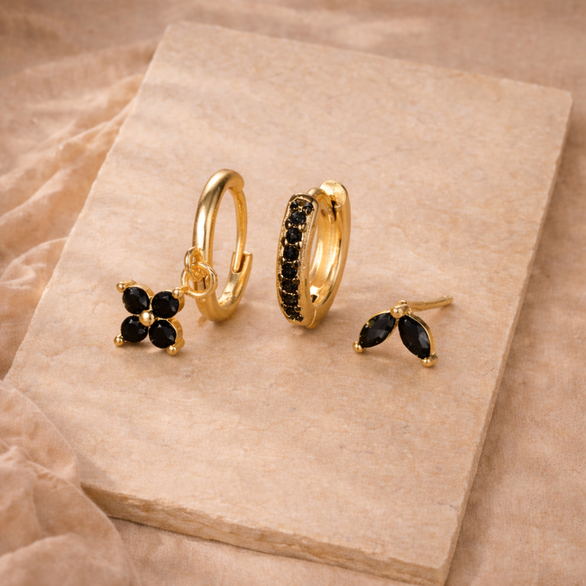 Unisex piercing set with various jewelry accessories for women, featuring multiple earrings and studs from FJØRNA.