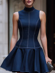 FJØRNA sleeveless high neck fit and flare mini dress shown on a model, featuring a stylish sleeveless design and flared skirt.