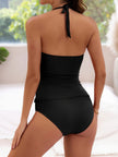 Women's FJØRNA halter tankini set with built-in support, featuring a stylish swimwear top and matching bottoms for beach or pool.