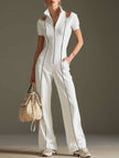 White cotton blend short sleeve wide-leg jumpsuit by FJØRNA, showing its relaxed fit and stylish design.