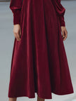 FJØRNA velvet pleated bow-neck midi dress featuring a flowy silhouette and elegant design, perfect for formal occasions.