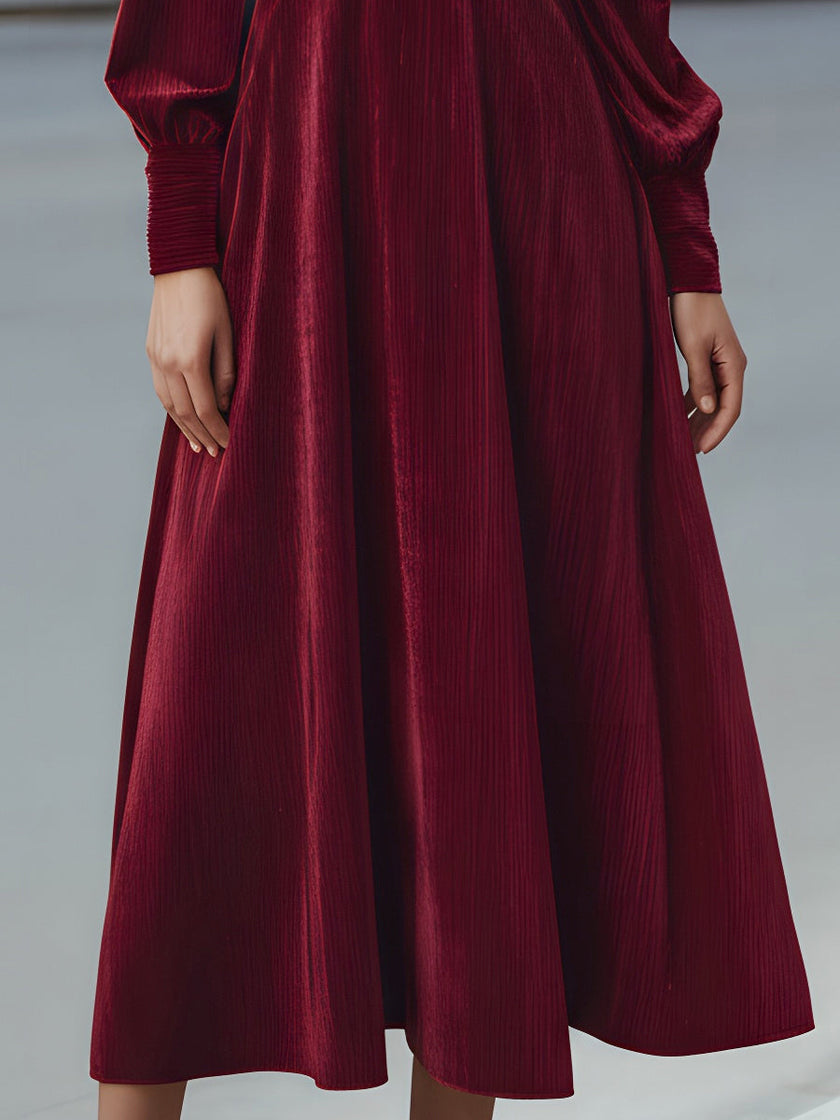 FJØRNA velvet pleated bow-neck midi dress featuring a flowy silhouette and elegant design, perfect for formal occasions.