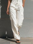 FJØRNA women's cotton blend sleeveless jumpsuit with single-breasted V-neck, tailored pants for a sleek, stylish look.
