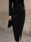 FJØRNA black turtleneck draped midi dress showcasing a sleek, fitted silhouette with elegant draping details.