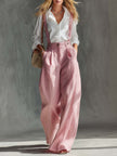 Pink cotton linen wide-leg dungarees for women by FJØRNA, featuring a relaxed fit and adjustable shoulder straps.