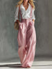 Pink cotton linen wide-leg dungarees for women by FJØRNA, featuring a relaxed fit and adjustable shoulder straps.