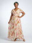 FJØRNA women's floral maxi dress with short sleeves, flowing fabric, elegant design, perfect for summer or casual occasions.
