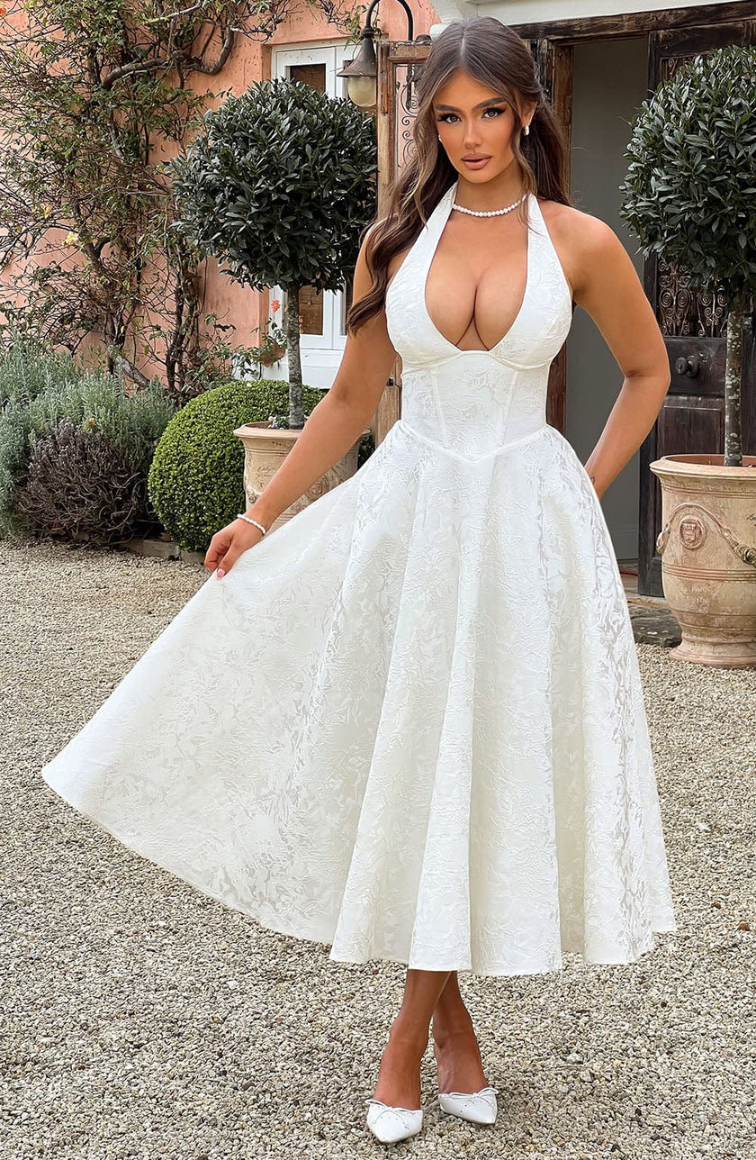Navy FJØRNA Bruna wedding guest halter midi dress with elegant fit and flowy design, perfect for formal occasions and weddings.