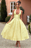 FJØRNA Bruna wedding guest halter midi dress in navy, featuring a stylish and elegant design for special occasions.