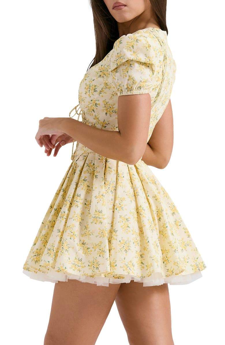 Yellow Emily Floral V-neck Corset Mini Dress by FJØRNA, showing a fitted dress with a floral pattern and V-neckline.