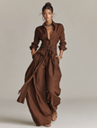 FJØRNA women's cotton-linen jumpsuit with shirt collar, long sleeves, wide-leg pants, and waist belt in brown color.