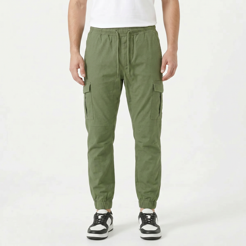 Men's slim fit cotton cargo trousers by FJØRNA, showing the tailored fit and multiple cargo pockets on the front.