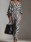 FJØRNA Statement Monochrome Stripe Asymmetric Maxi Dress in white, featuring bold stripe pattern and elegant flowing design.