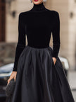 FJØRNA elegant black velvet and satin midi dress for women, showcasing a sophisticated design with a fitted bodice and flowing skirt.