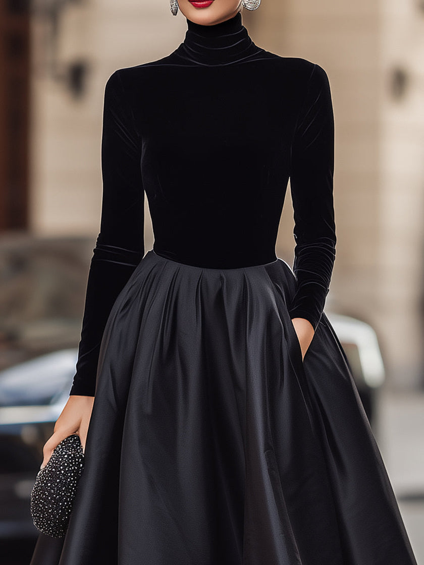 FJØRNA elegant black velvet and satin midi dress for women, showcasing a sophisticated design with a fitted bodice and flowing skirt.