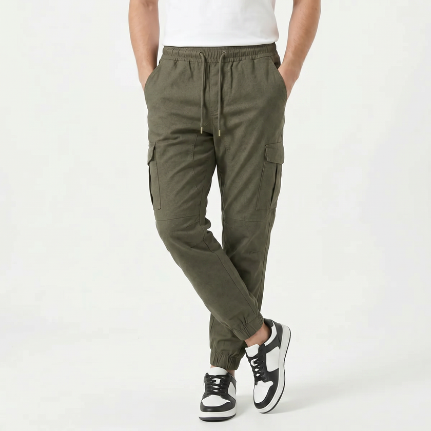 Men's slim fit cotton cargo trousers by FJØRNA, featuring multiple pockets and a modern, tapered design.